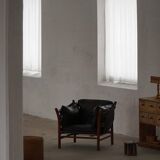 "Lounge chair 'Ilona' by Arne Norell in stained beech and leather, mid-20th century."