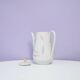 White teapot with pastel flowers