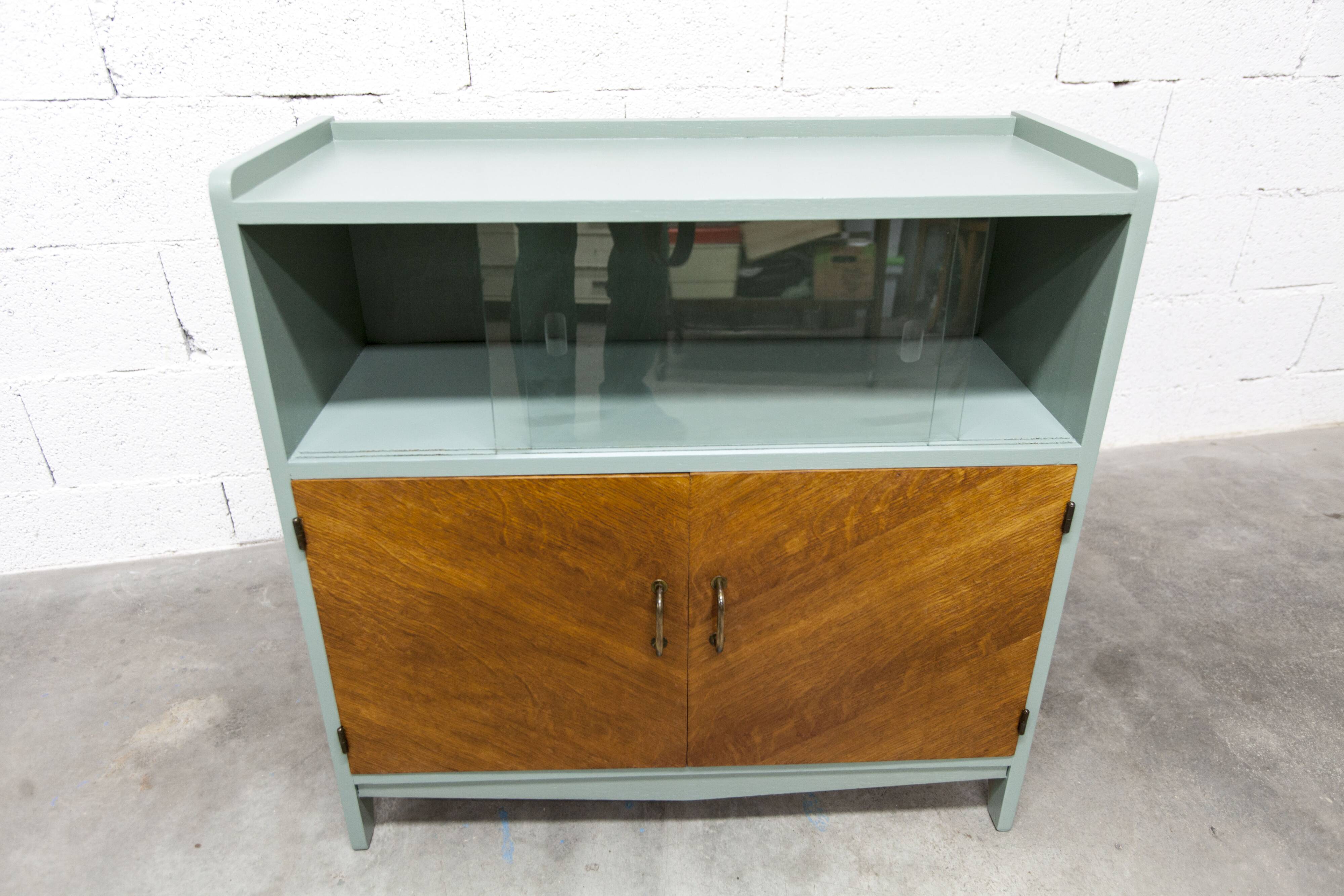 Atypical green noble 1960s low display cabinet.