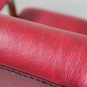 Vintage armchair in red leatherette