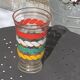 Transparent and gold glass vase and red, white, green and yellow silkscreen lines vintage 1960