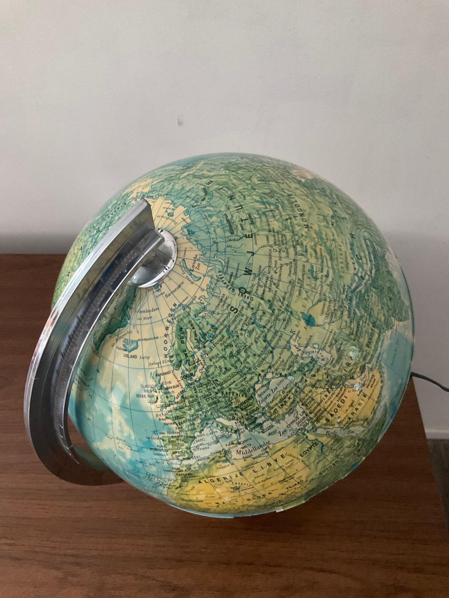 Bright vintage world map with wooden foot