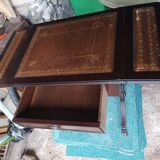 Folding table with a leather top