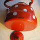 Vintage kettle in red enamelled sheet with white polka dots