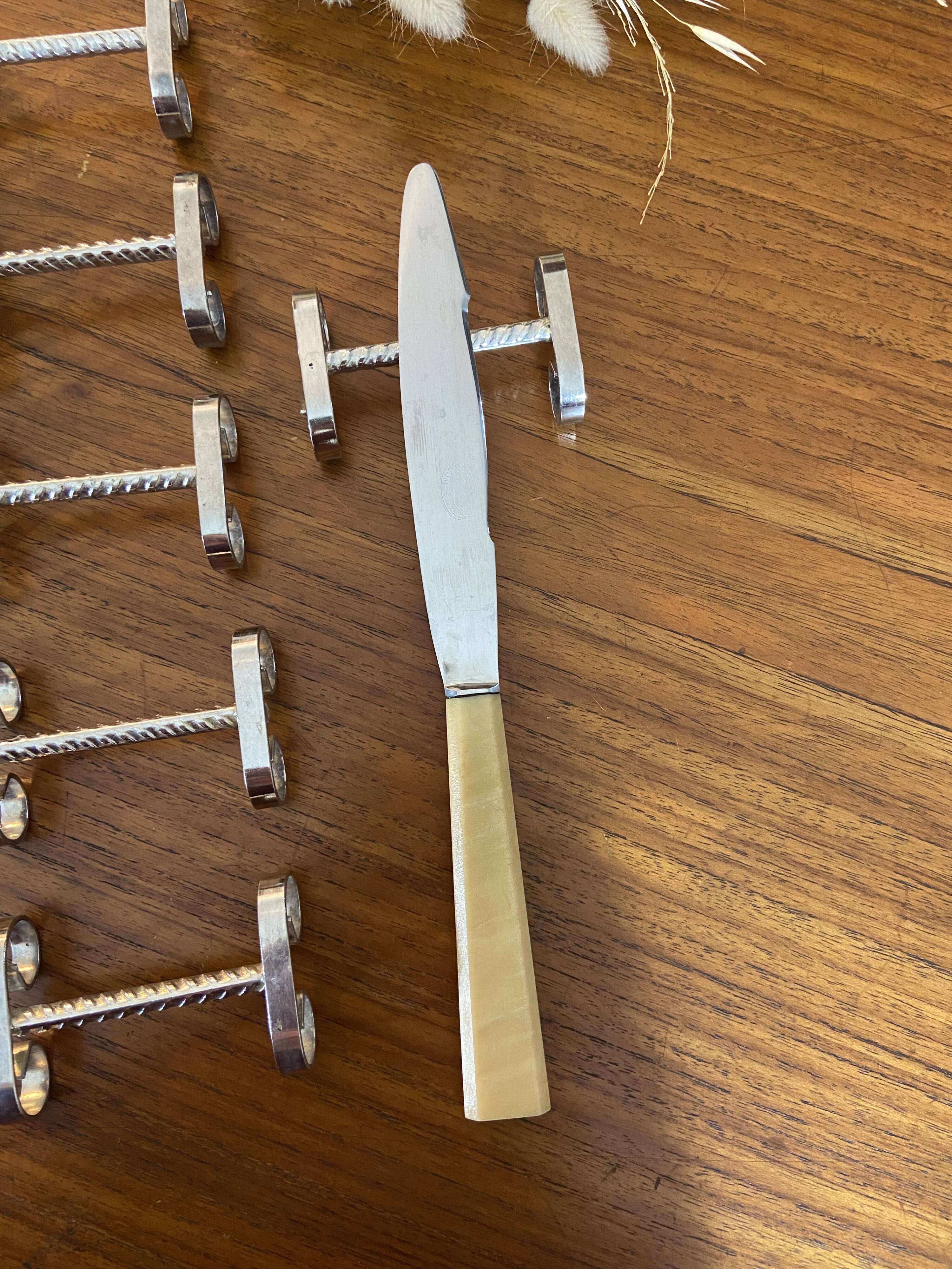 Set of 11 silver-plated metal knife holders, 1960
