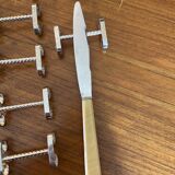 Set of 11 silver-plated metal knife holders, 1960