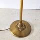 Halogen floor lamp in golden brass