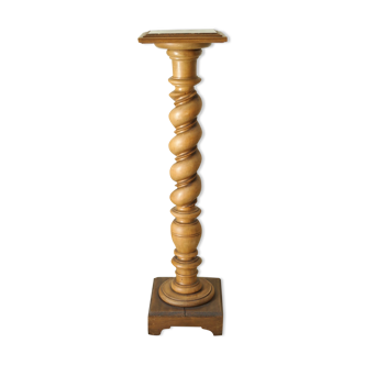 Old column harness in twisted wood and red marble