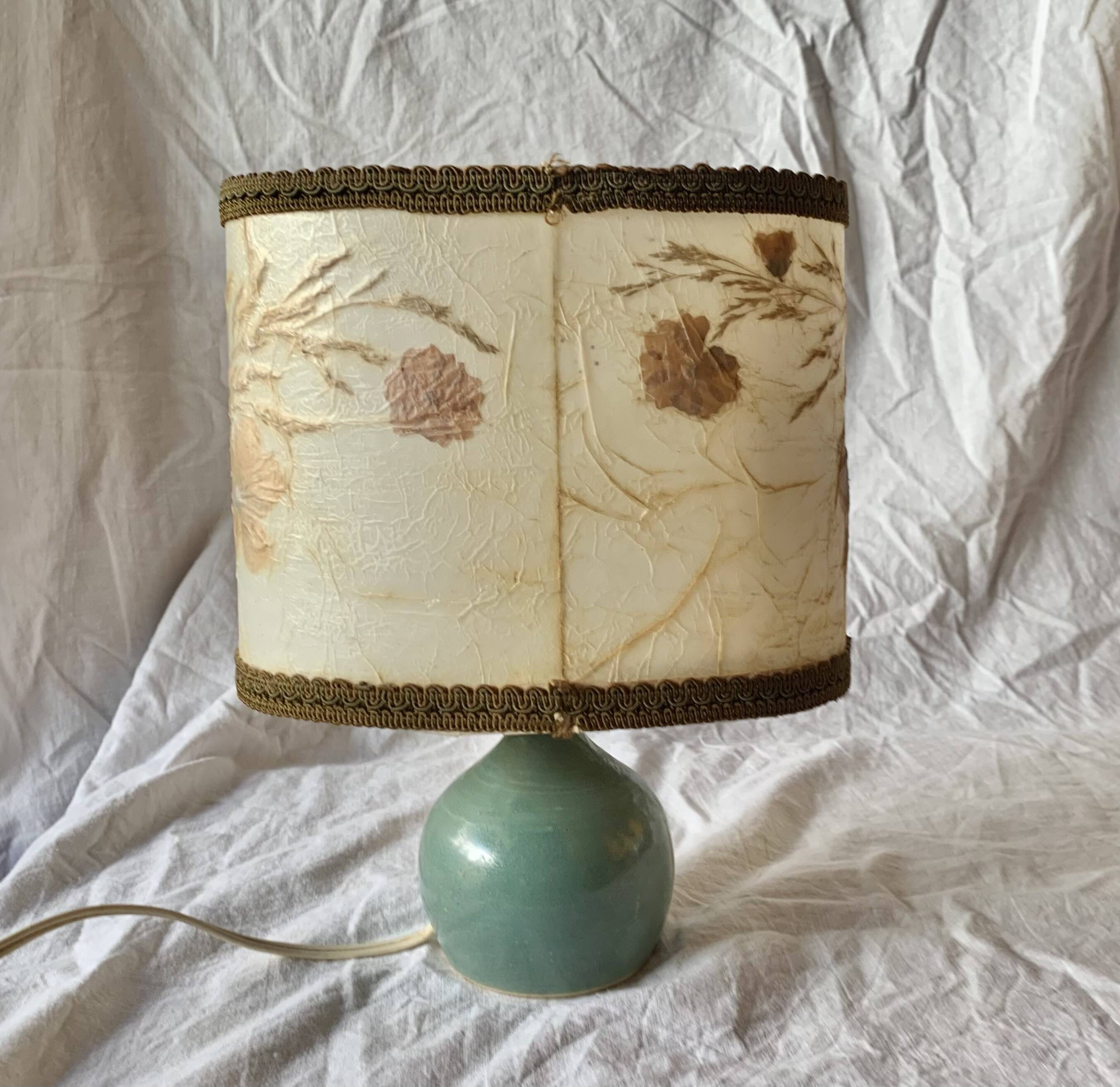 Old small green ceramic side lamp with dried flower lampshade