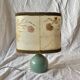 Old small green ceramic side lamp with dried flower lampshade