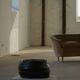 Vintage black leather pouf/ottoman with a rounded shape, French mid 20th Century.