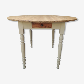 Round table with flaps and drawer
