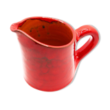 Bright red ceramic pitcher