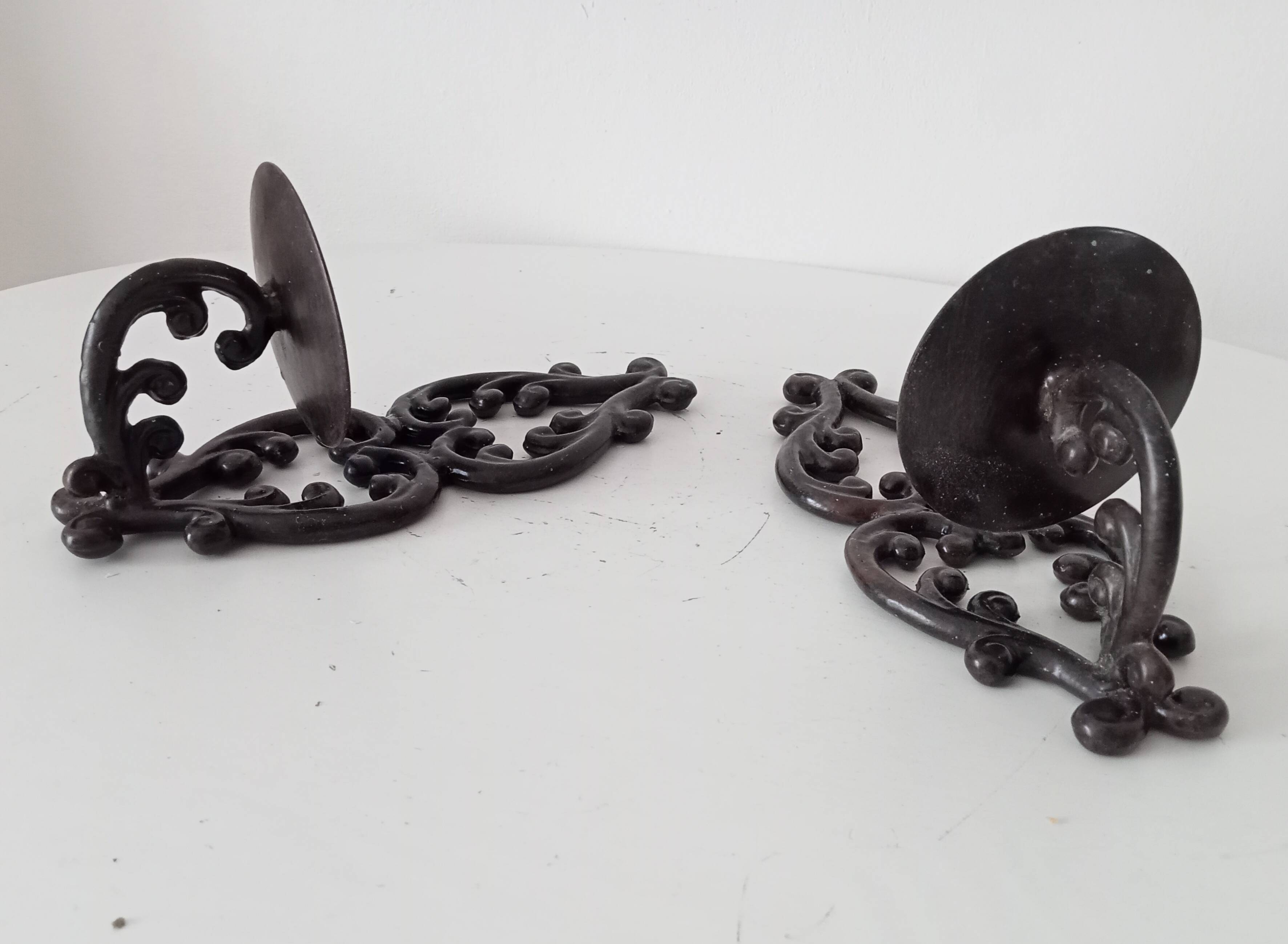Antique wall candle holder in enamelled cast iron
