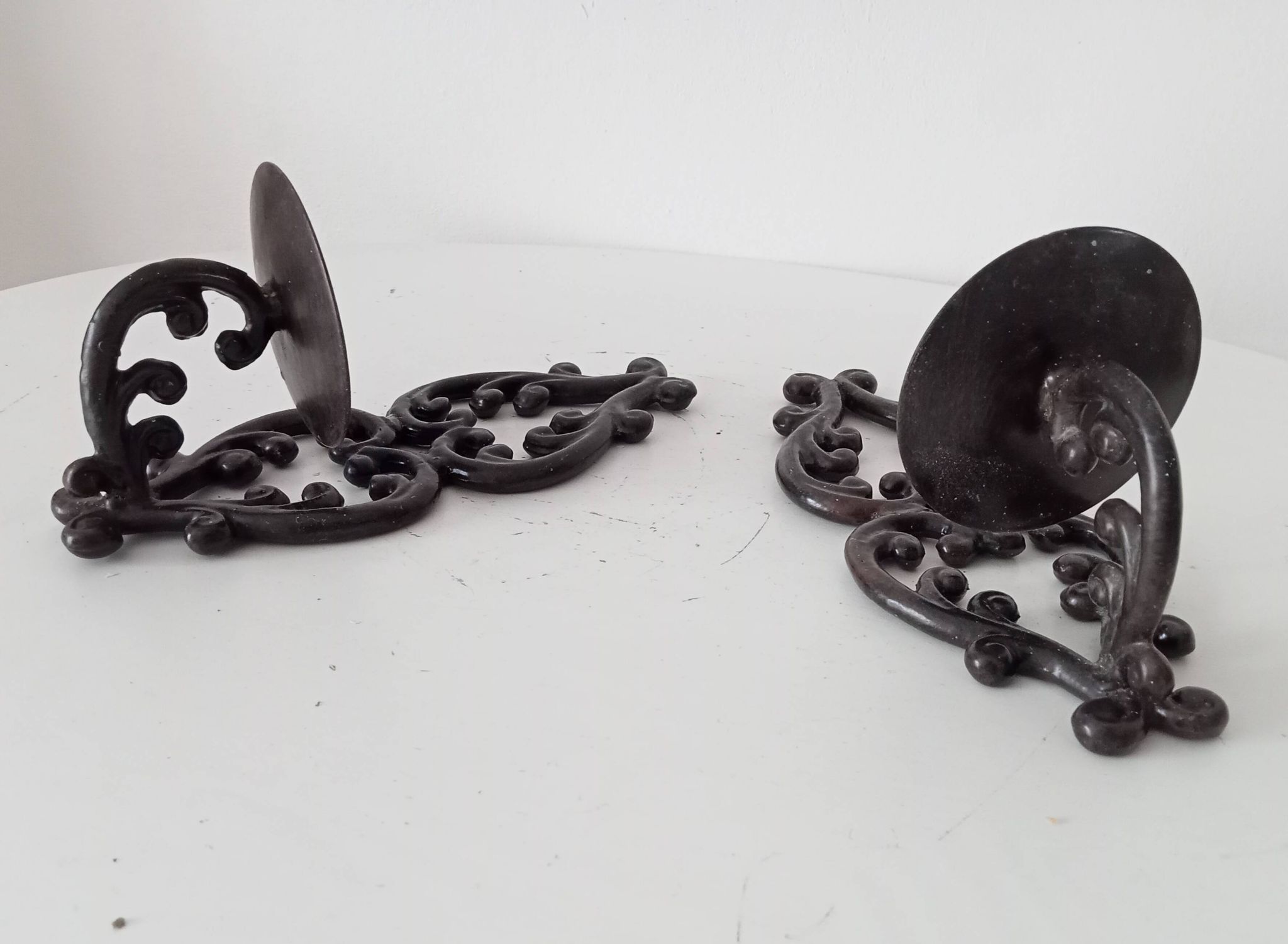 Antique wall candle holder in enamelled cast iron