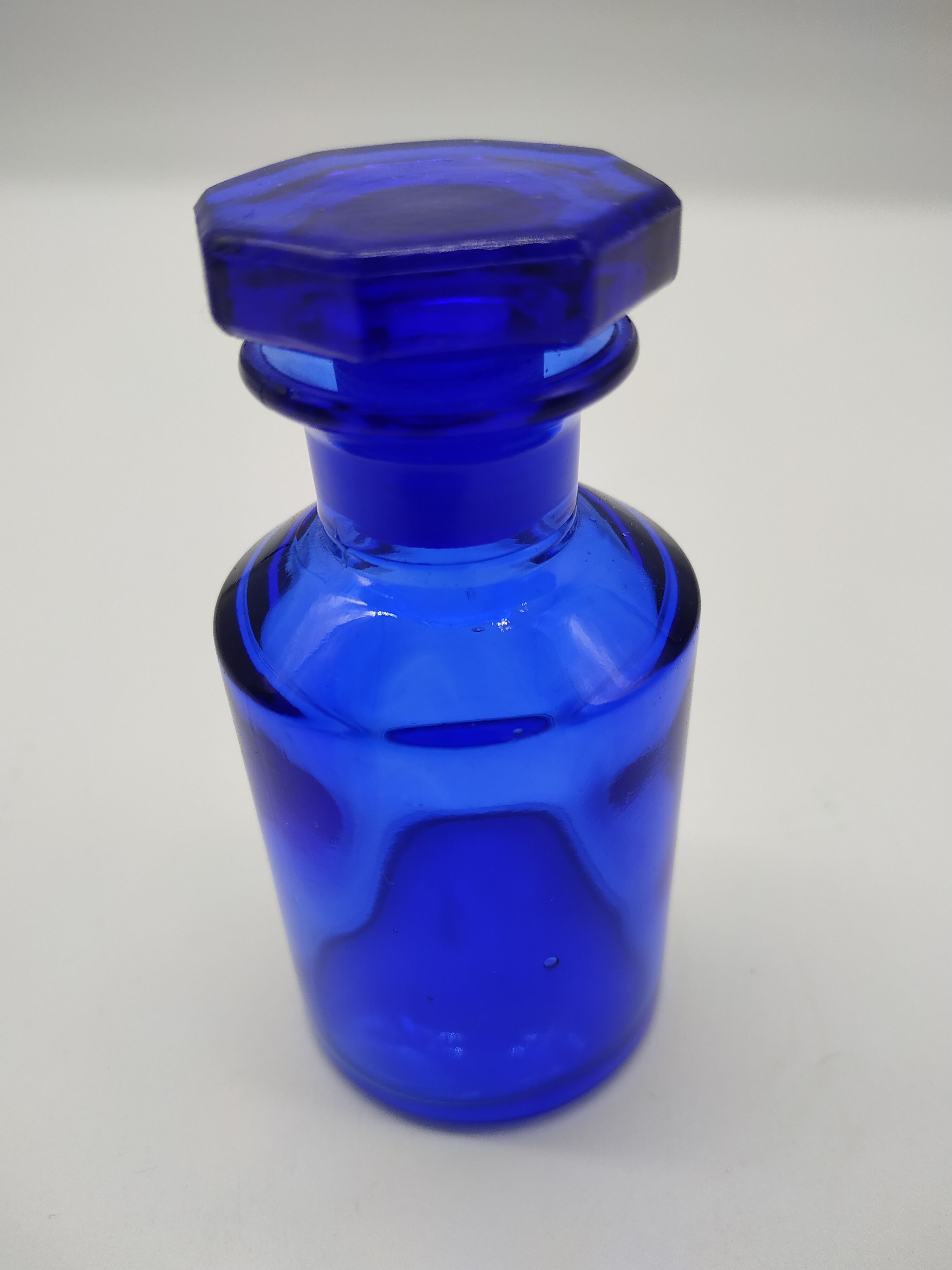 Old perfume bottle in cobalt blue glass
