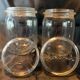 Two old vintage white glass jars