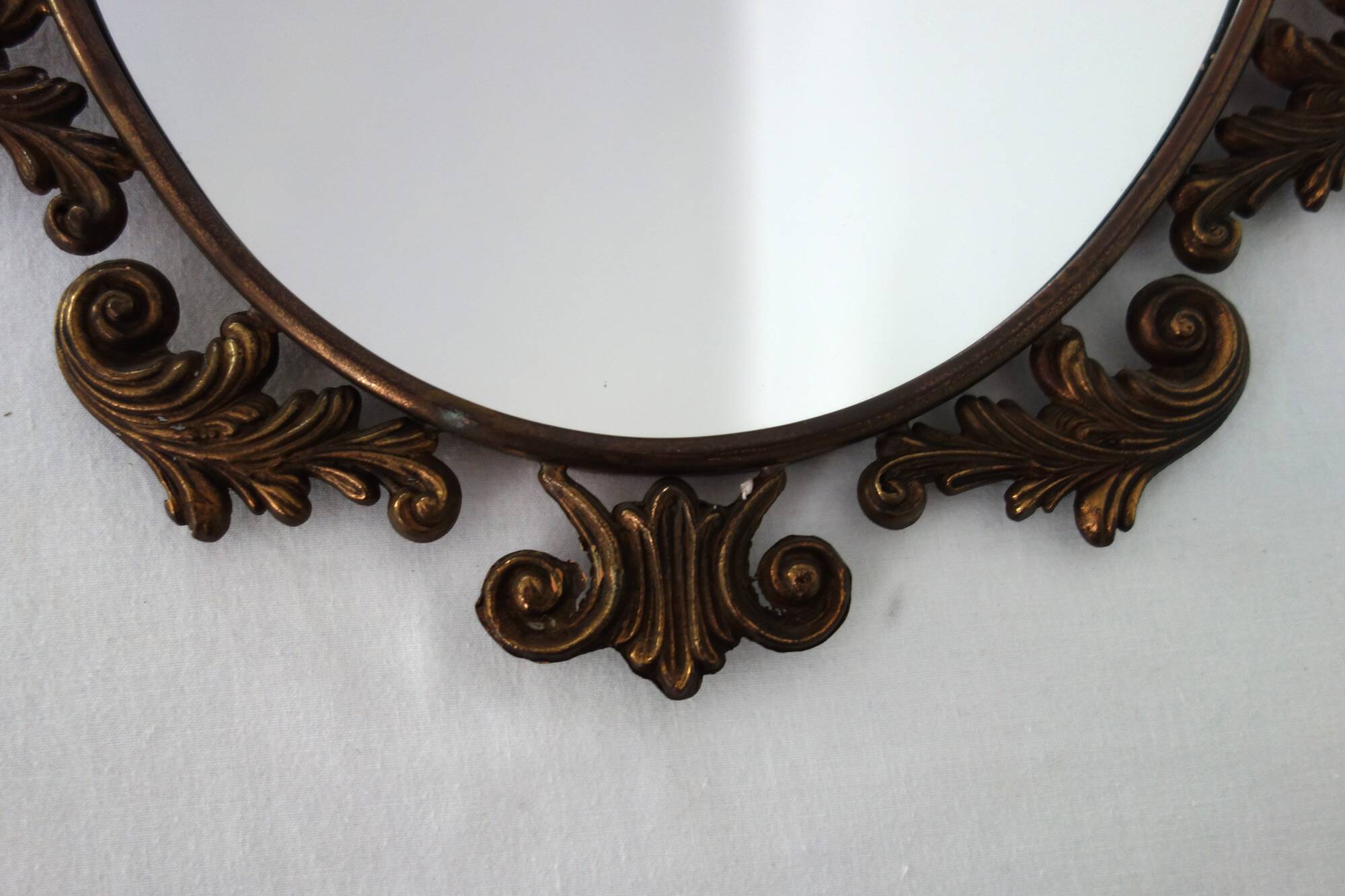Antique oval art deco brass mirror