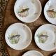 Set of 10 antique flat plates in porcelain, decorated with fish.
