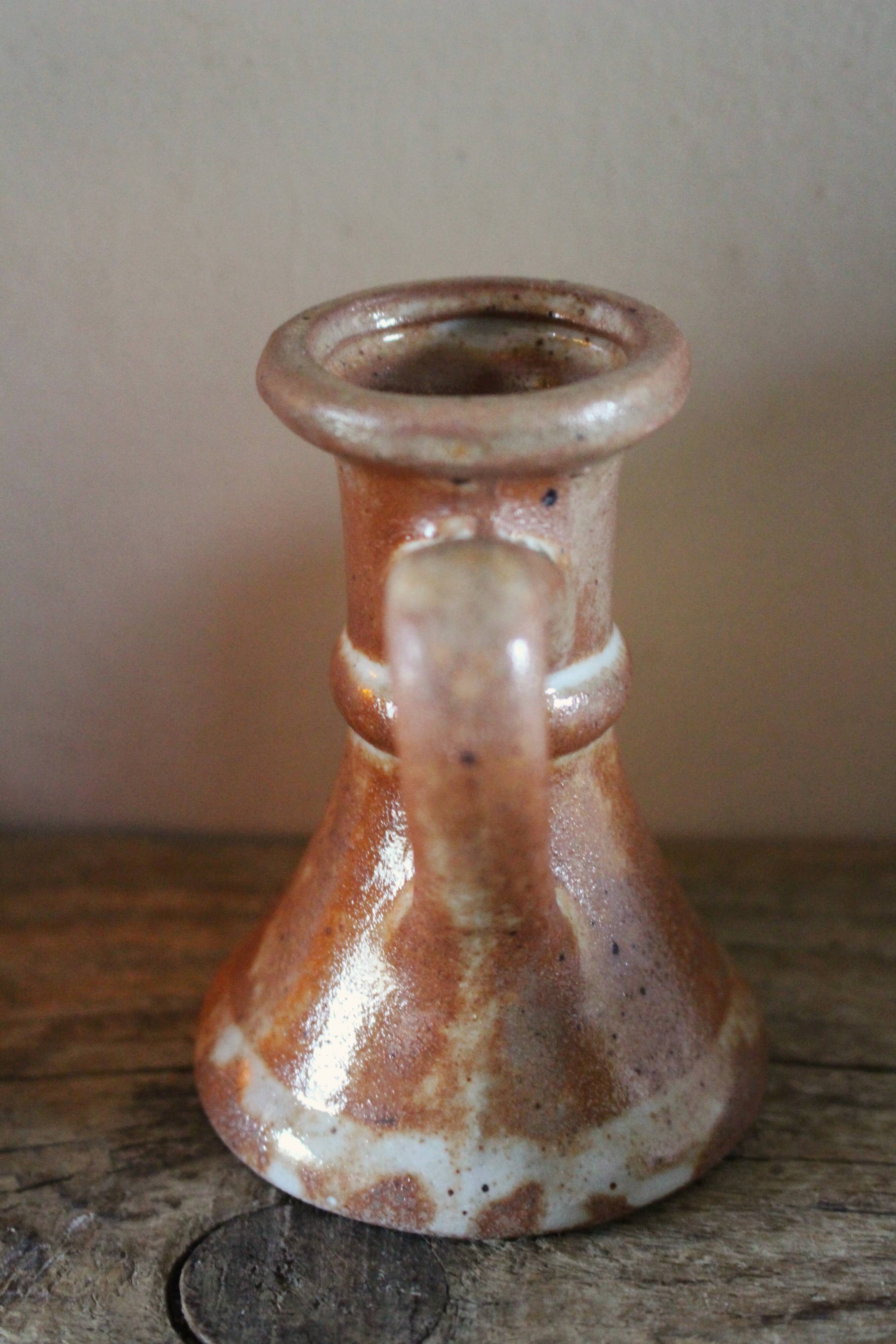 Small vintage marbled stoneware candlestick with handle