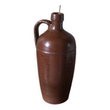 Vintage stoneware liqueur bottle with handle and spout.