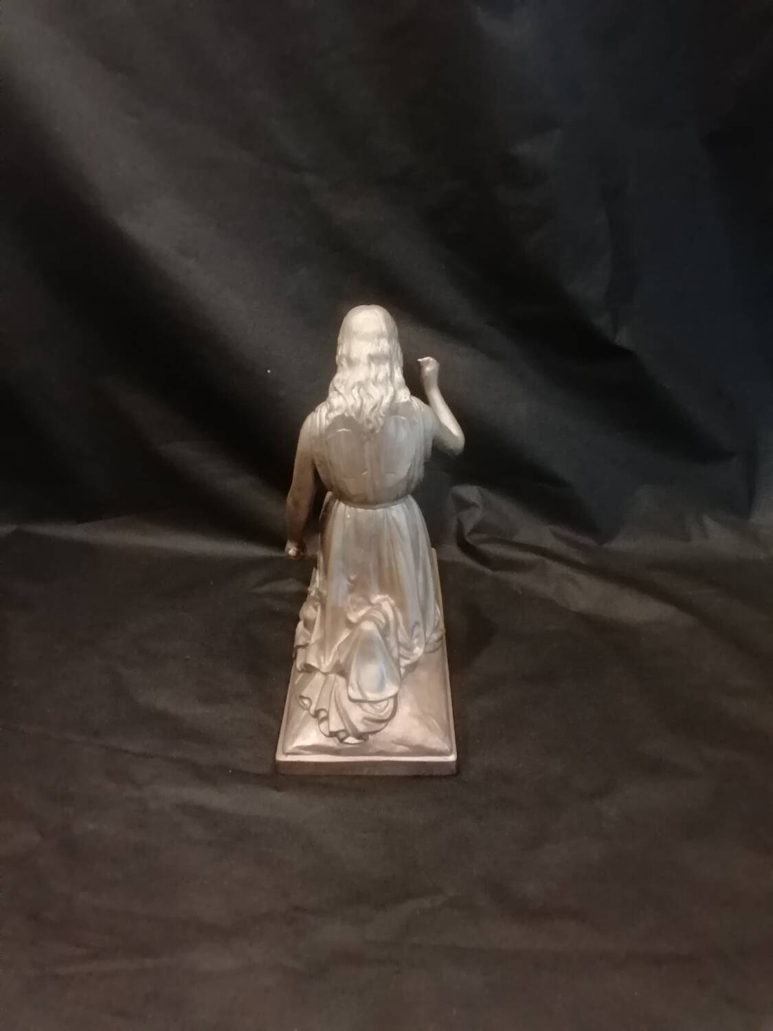 Statuette of a woman in gilded cast iron (Joan of Arc?)