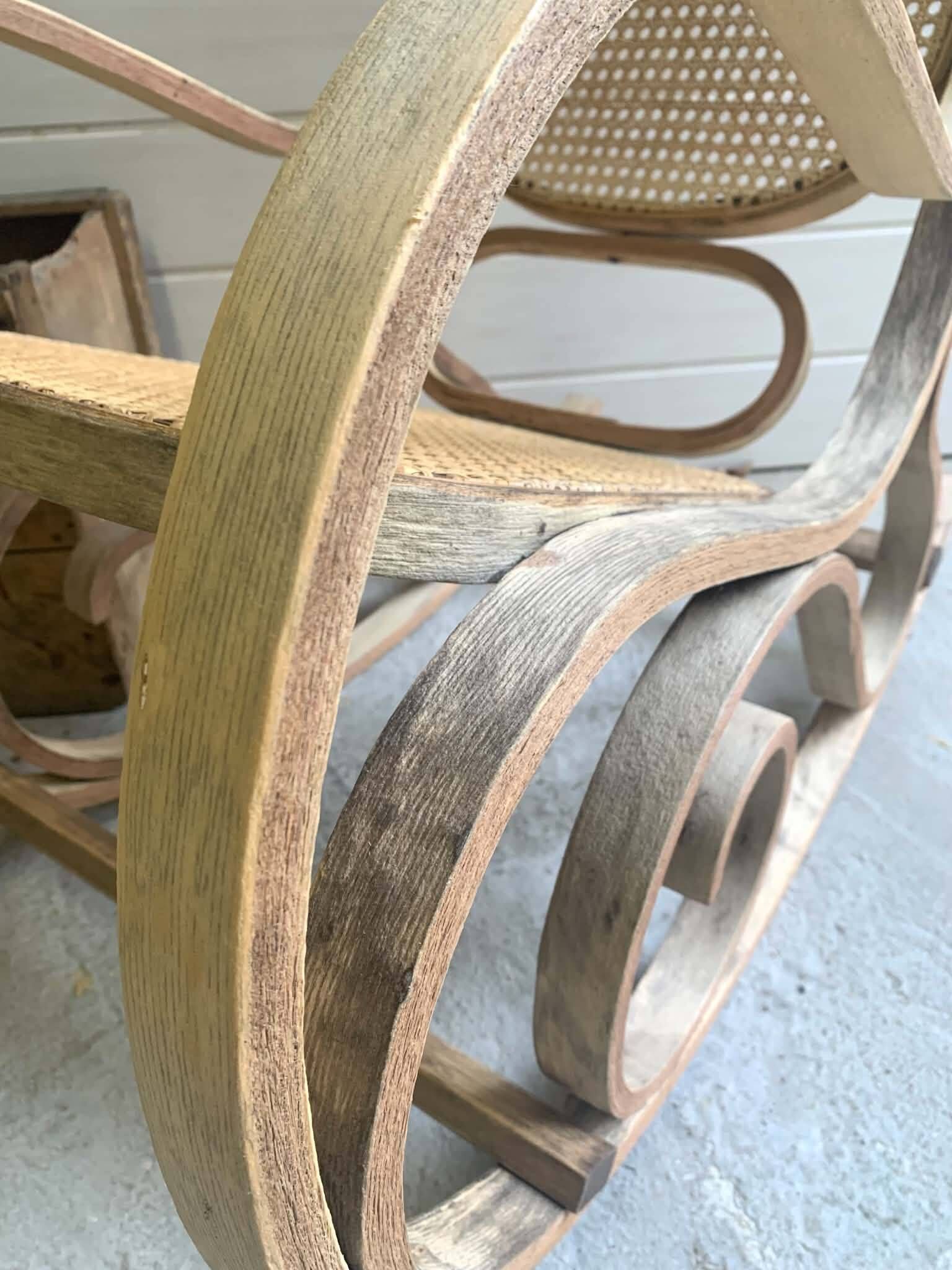 Rocking chair with a cane seat and backrest.