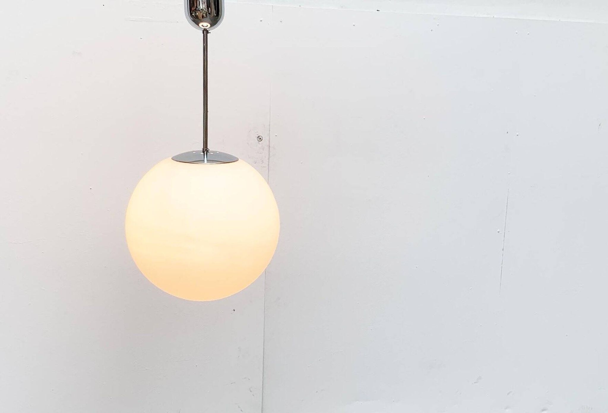Vintage German space age glass ball pendant lamp by Limburg.