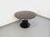 Vintage dining table in melamine with a black wood effect and chrome metal.