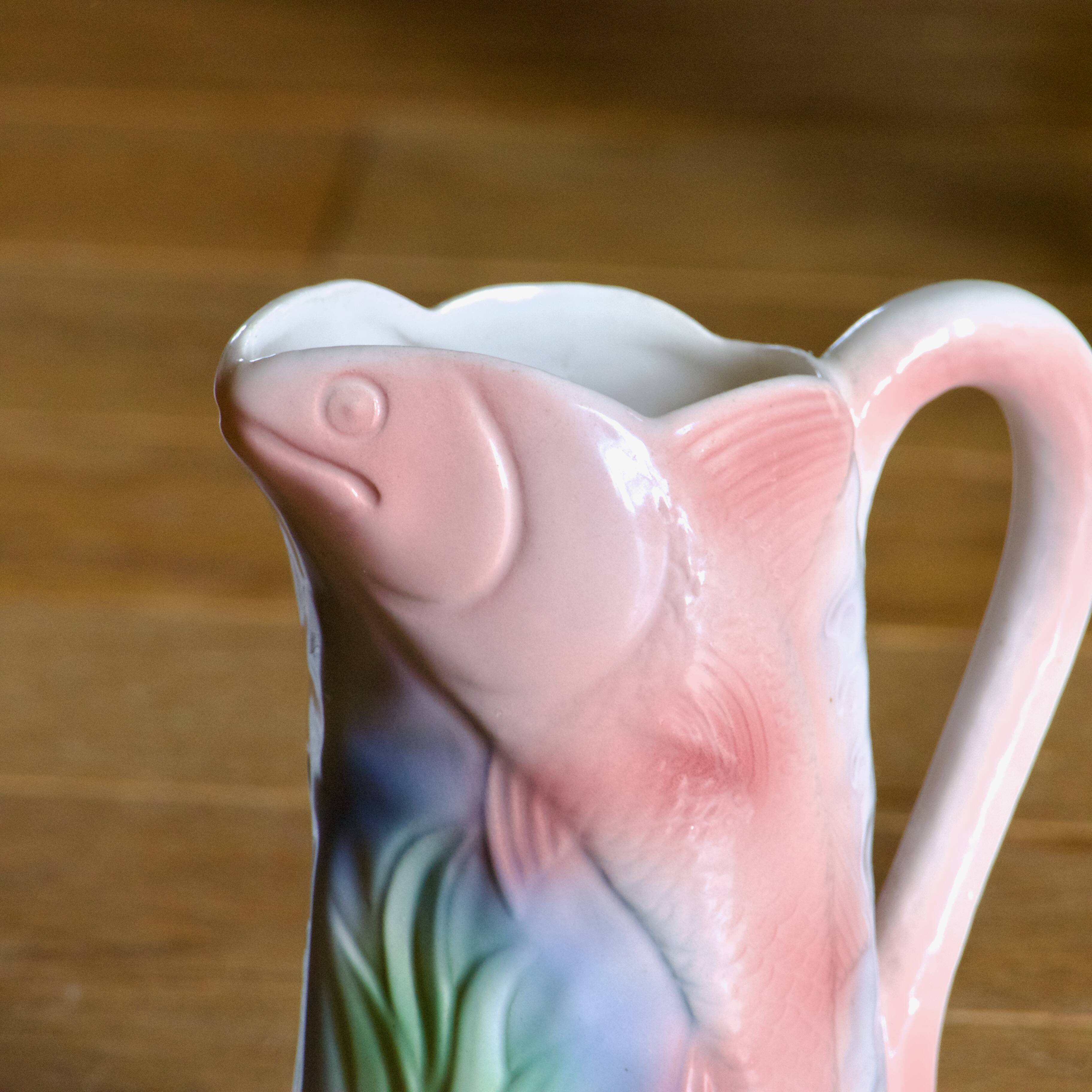 Vintage carafe in colorful fish slip