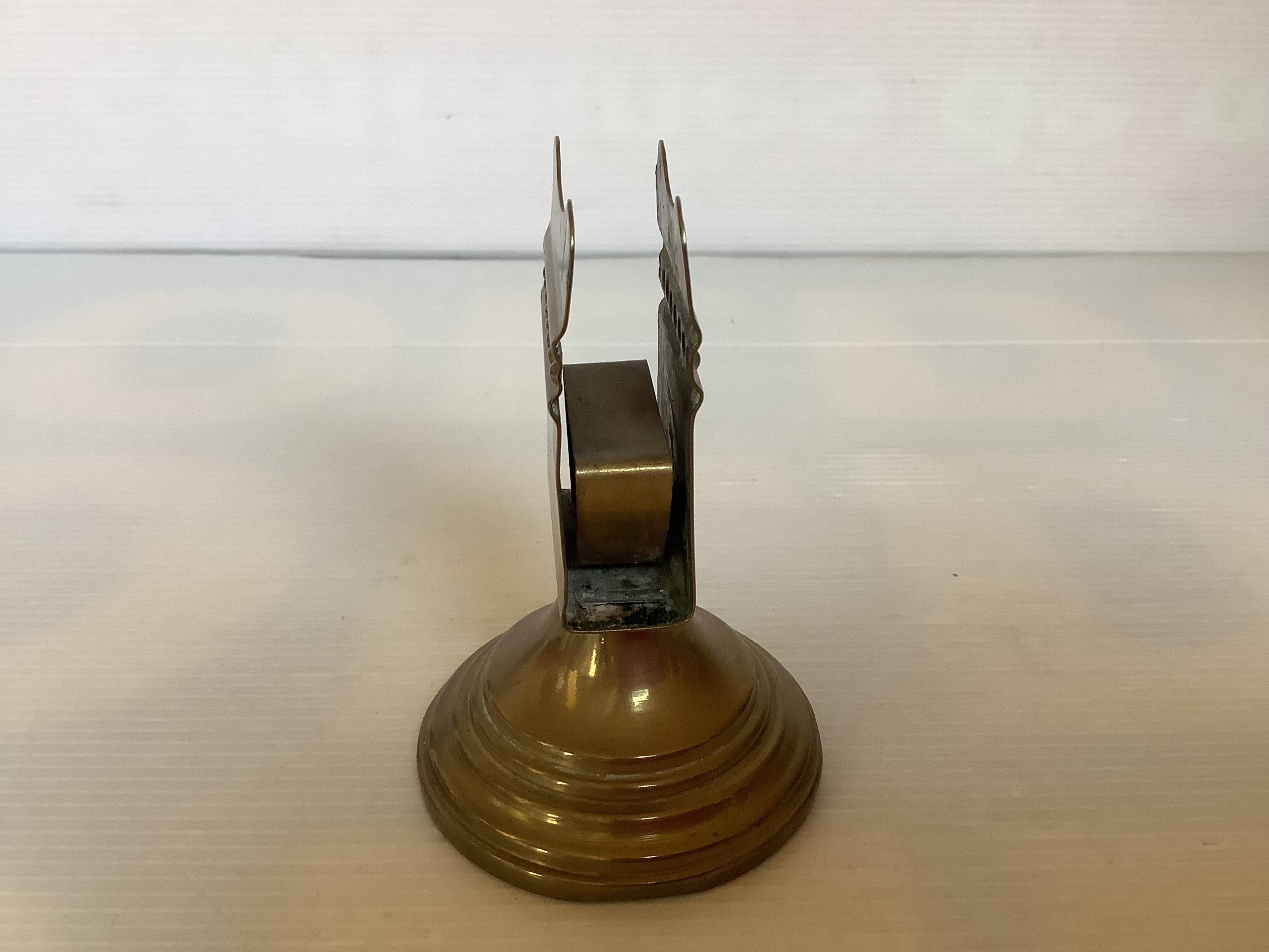 Antique brass match holder with tulip base.
