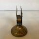 Antique brass match holder with tulip base.