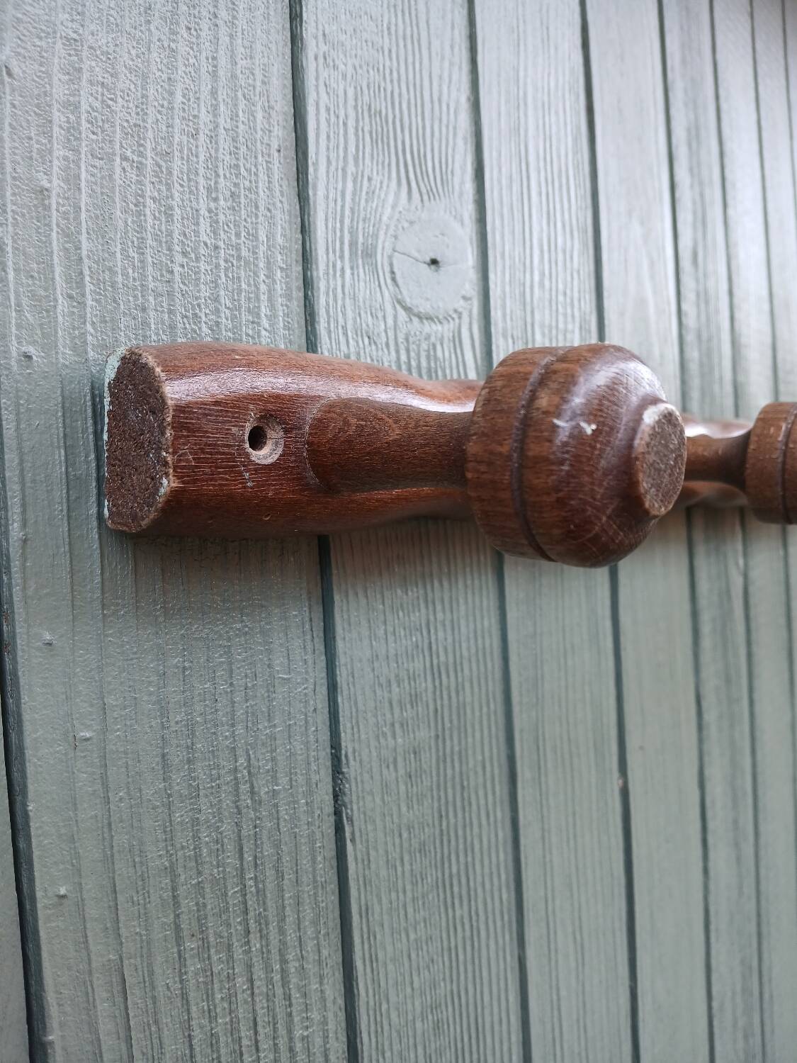 Small antique wooden wall coat rack.