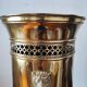 Vintage brass umbrella stand with lion decoration.
