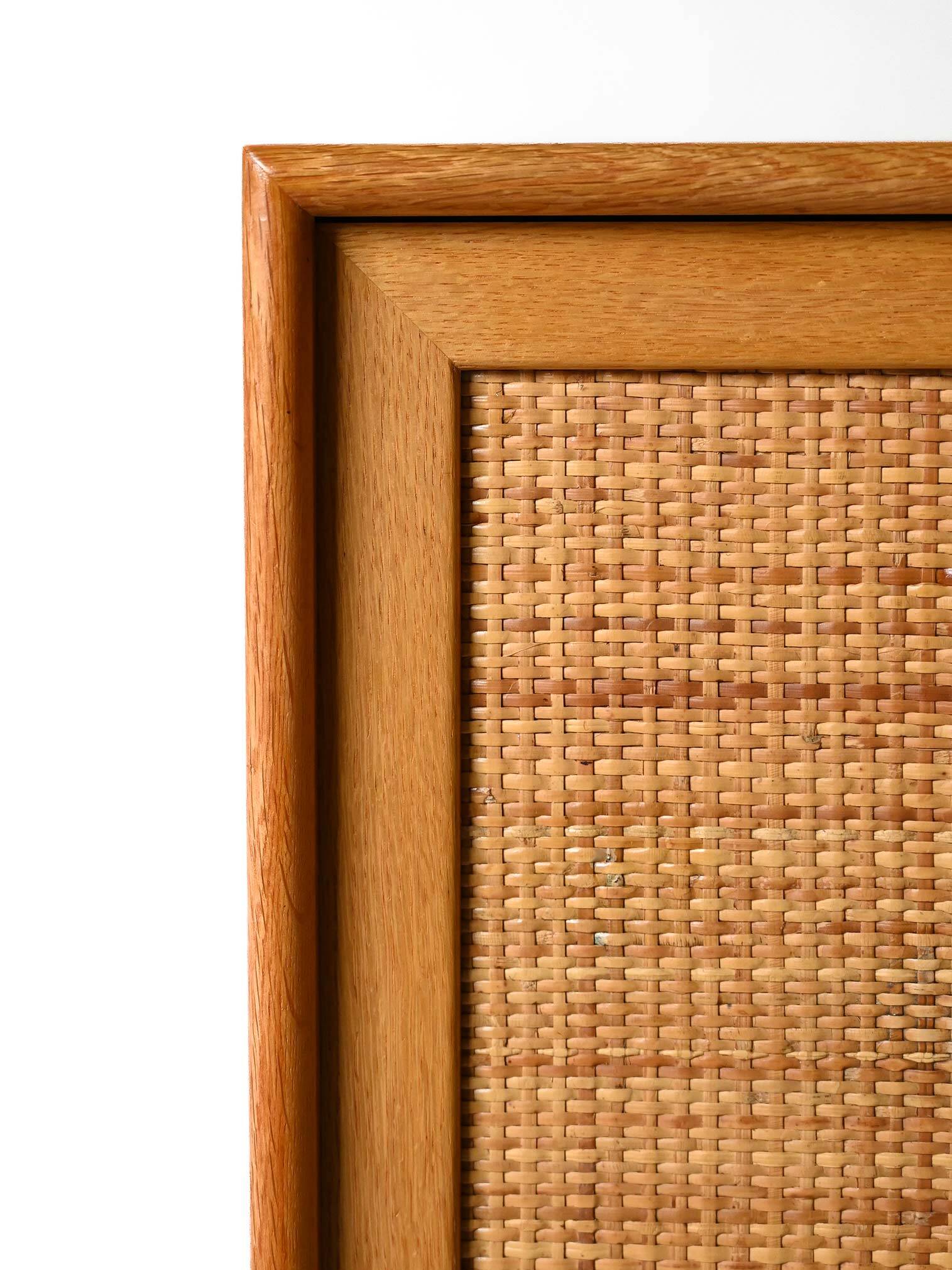 Scandinavian oak cabinet with woven rattan doors