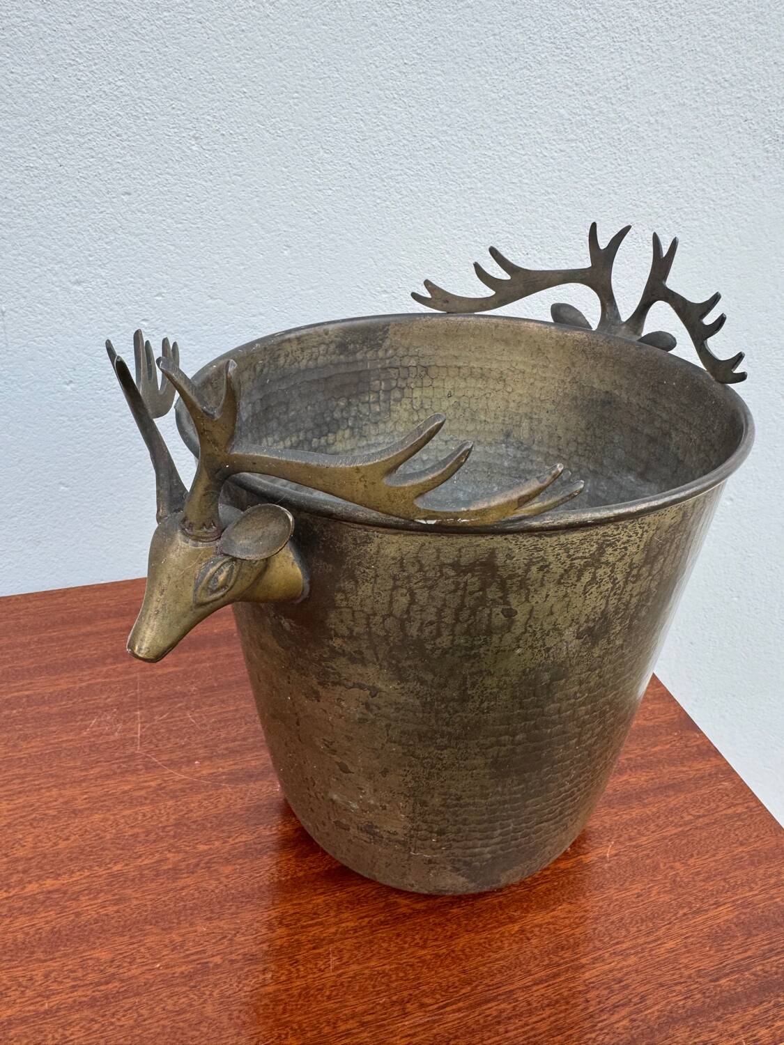 Antique champagne cooler with stag heads