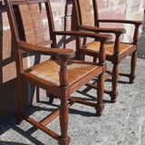 Pair of oak armchairs with straw seats and backs.