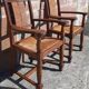 Pair of oak armchairs with straw seats and backs.