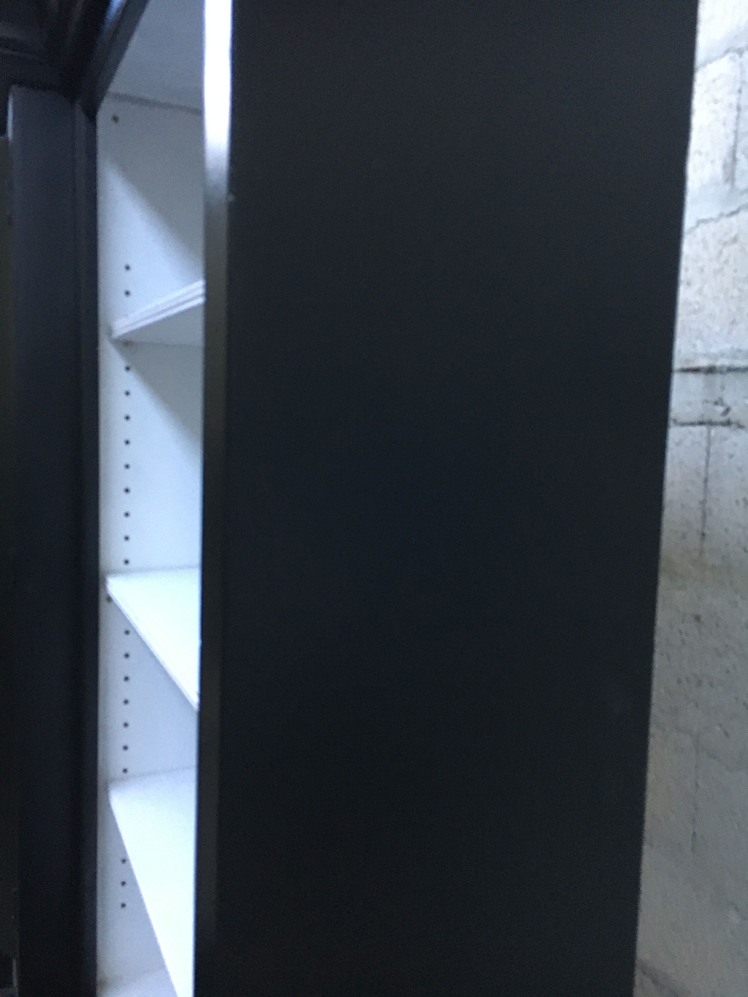 Black patinated wooden bookcase