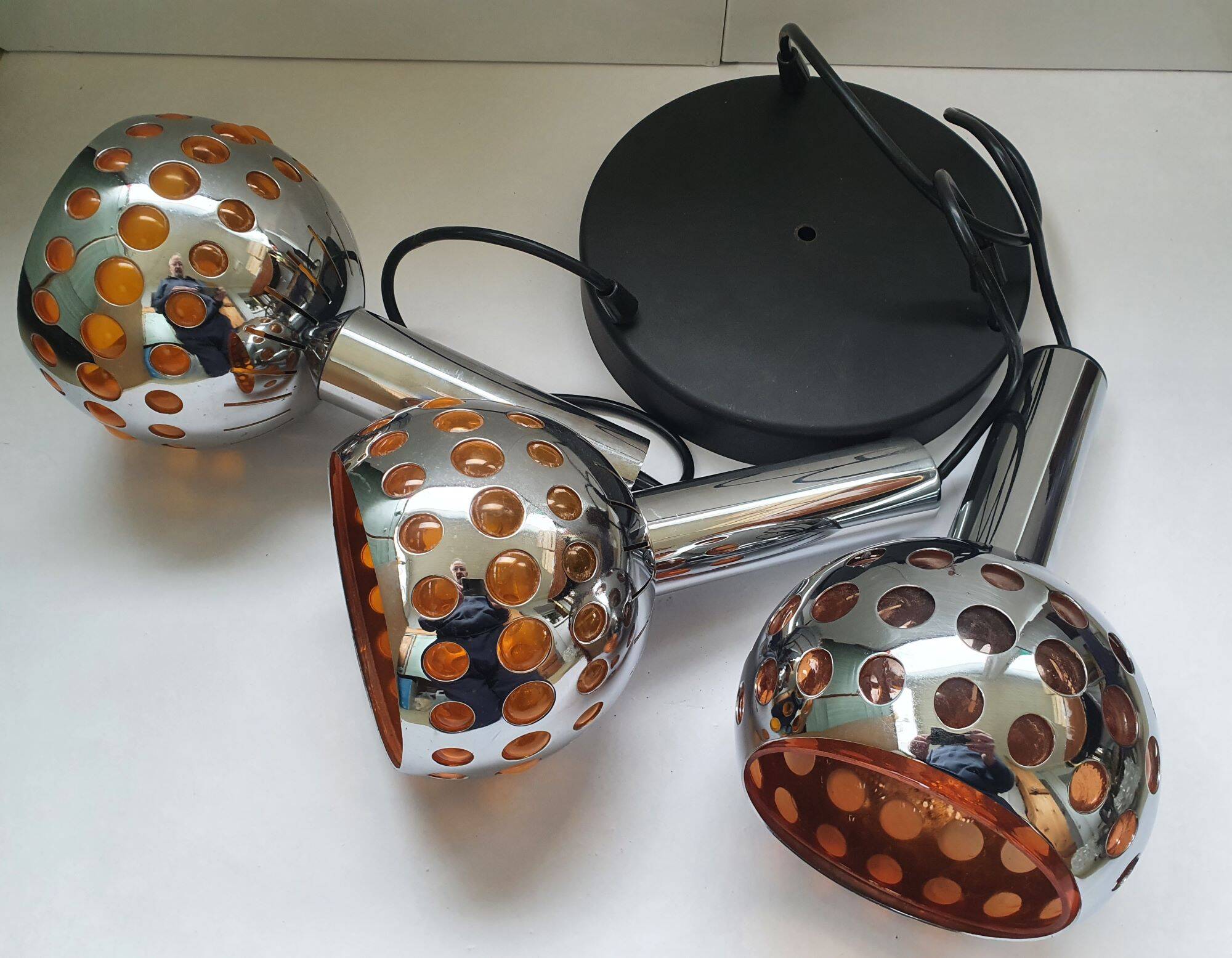 Raak three-light space age orange pendant lamp, 1970s, Netherlands