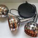 Raak three-light space age orange pendant lamp, 1970s, Netherlands