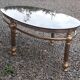 Oval coffee table in gilded brass and smoked glass 1970