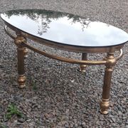 Oval coffee table in gilded brass and smoked glass 1970