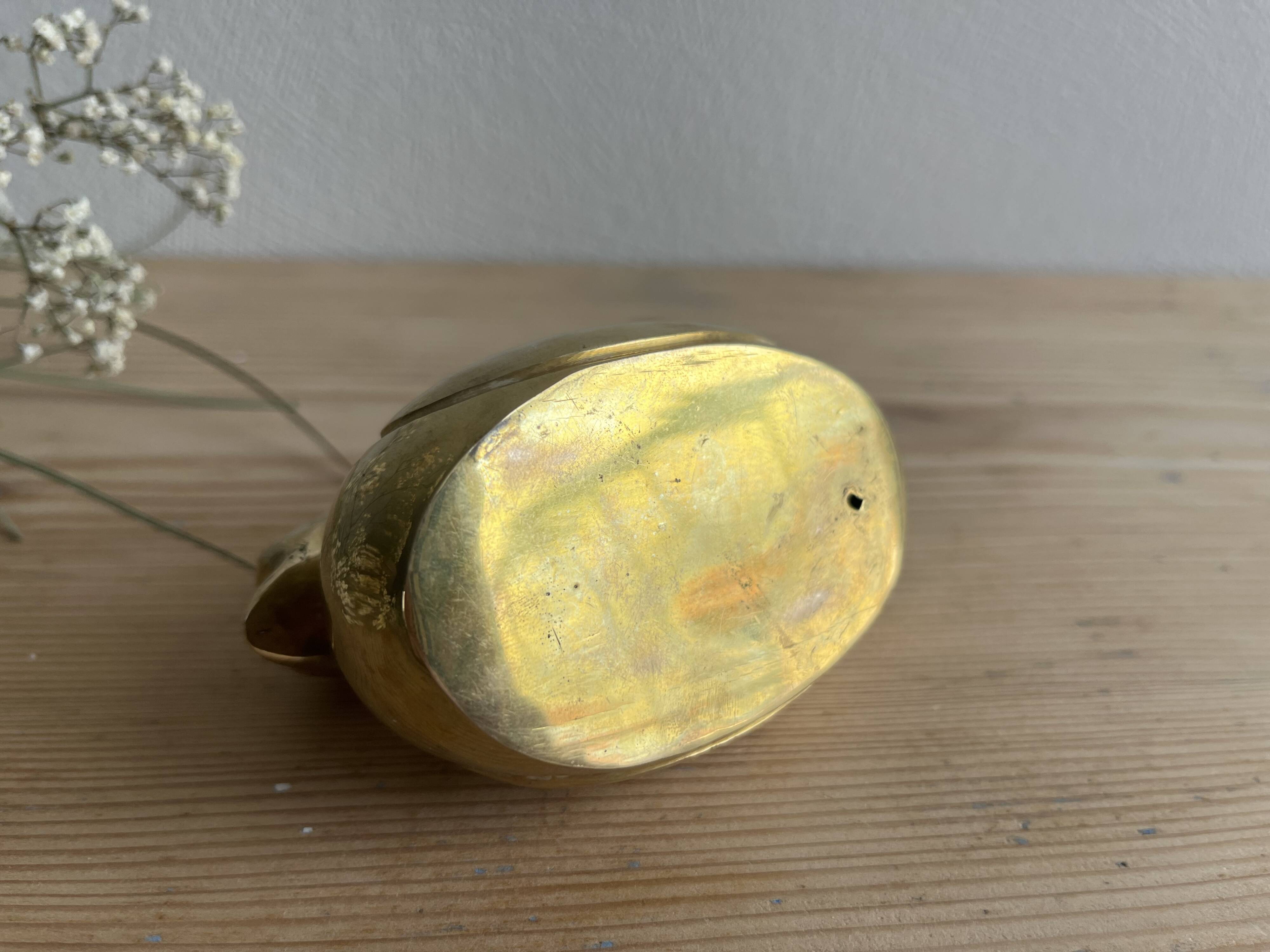 Brass duck candle holder