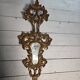 Italian mirror in gilded wood with gold leaf from the 18th century.