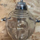 Old glass and metal liquid soap dispenser