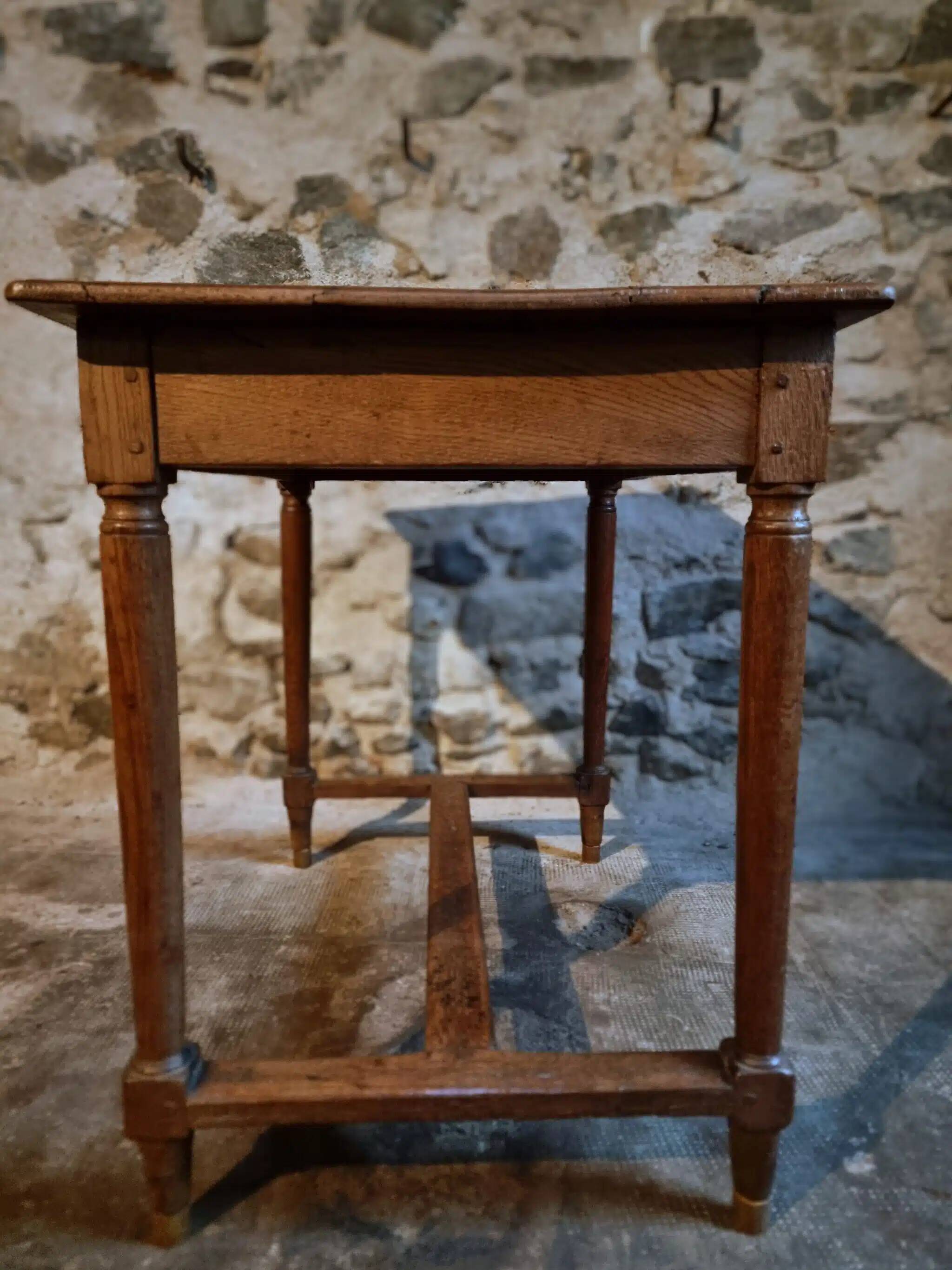 Antique French oak table, writing table from the early 19th century.