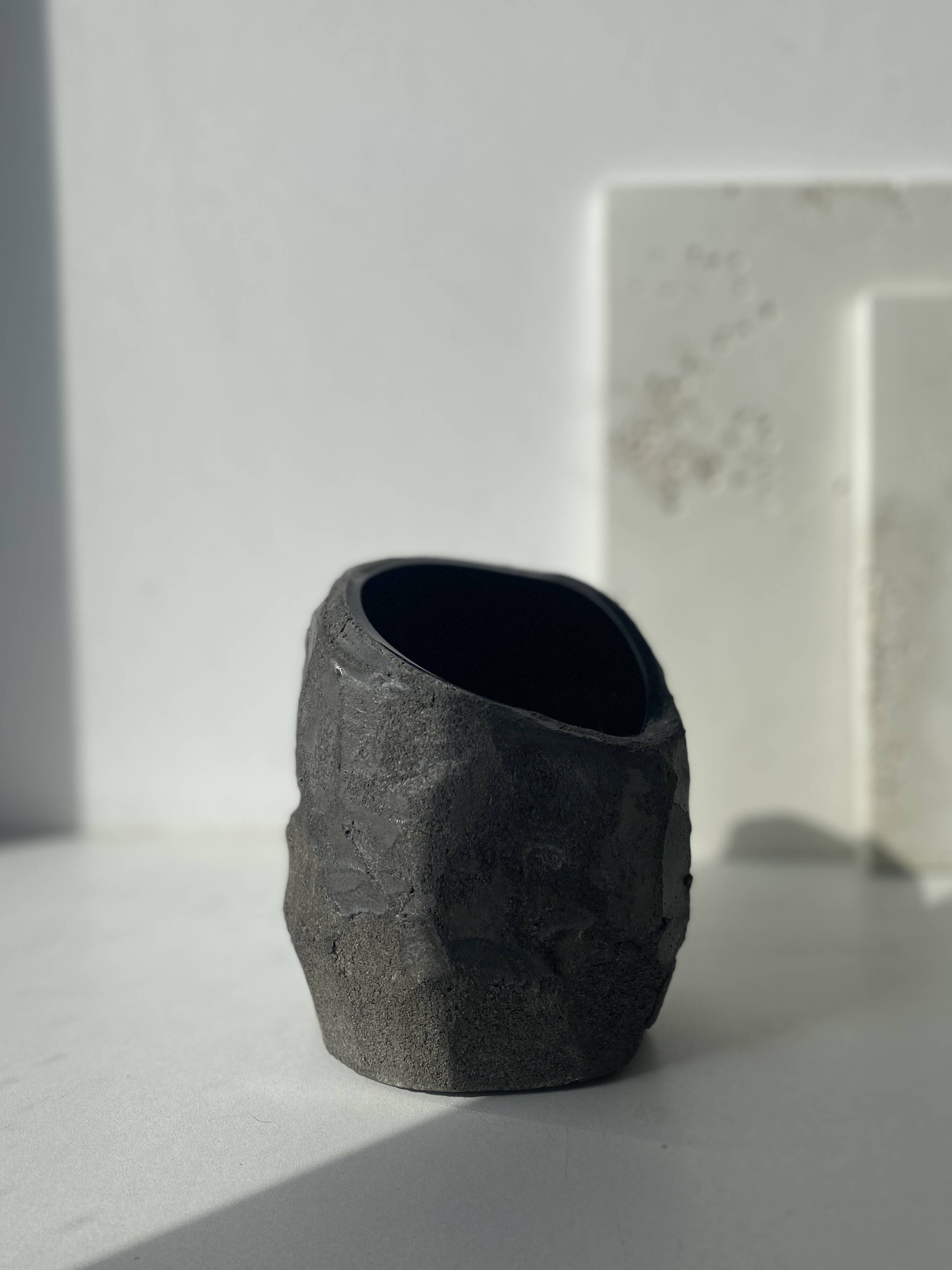 Asymmetrical sculpted concrete vase