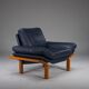 Danish teak and navy blue leather lounge chair from Komfort, 1970s