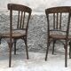 Pair of brasserie bistro chairs with seashell on seat